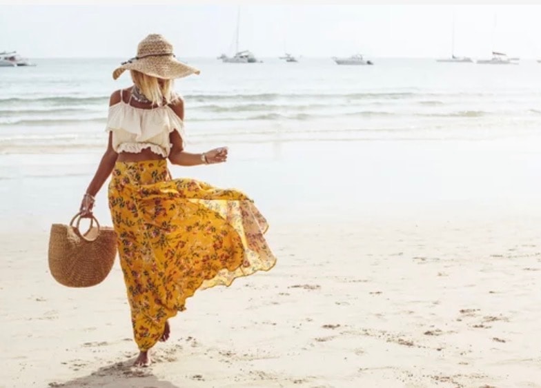 Yellow floral skirt on the beach